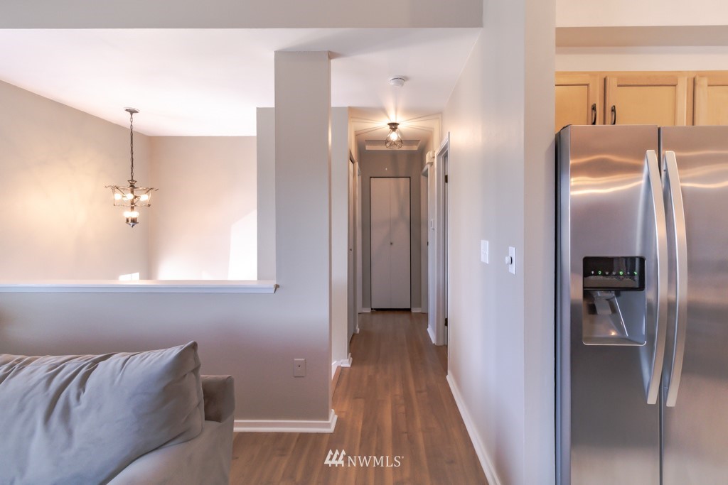 2829 Northeast 4th Court Renton, WA 98056 - Photo 2 of 26 a view of hallway with furniture and a chandelier