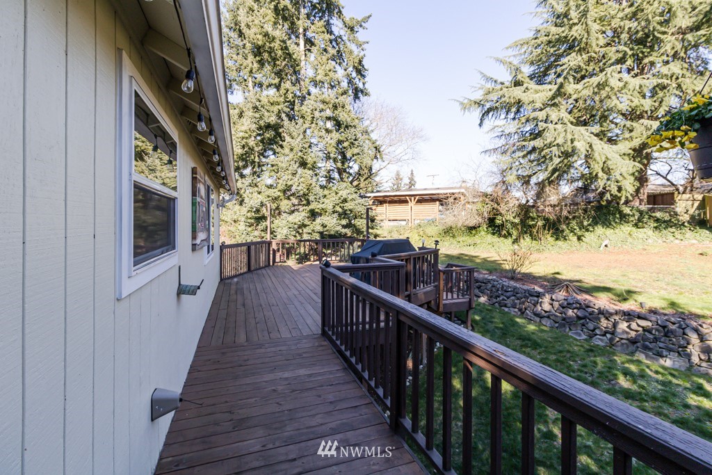 2829 Northeast 4th Court Renton, WA 98056 - Photo 21 of 26 a view of a balcony with wooden floor and fence