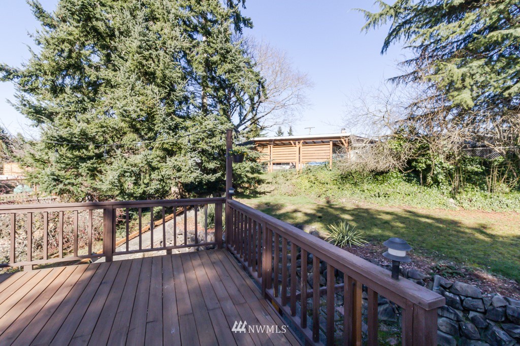 2829 Northeast 4th Court Renton, WA 98056 - Photo 22 of 26 a view of a balcony with wooden floor