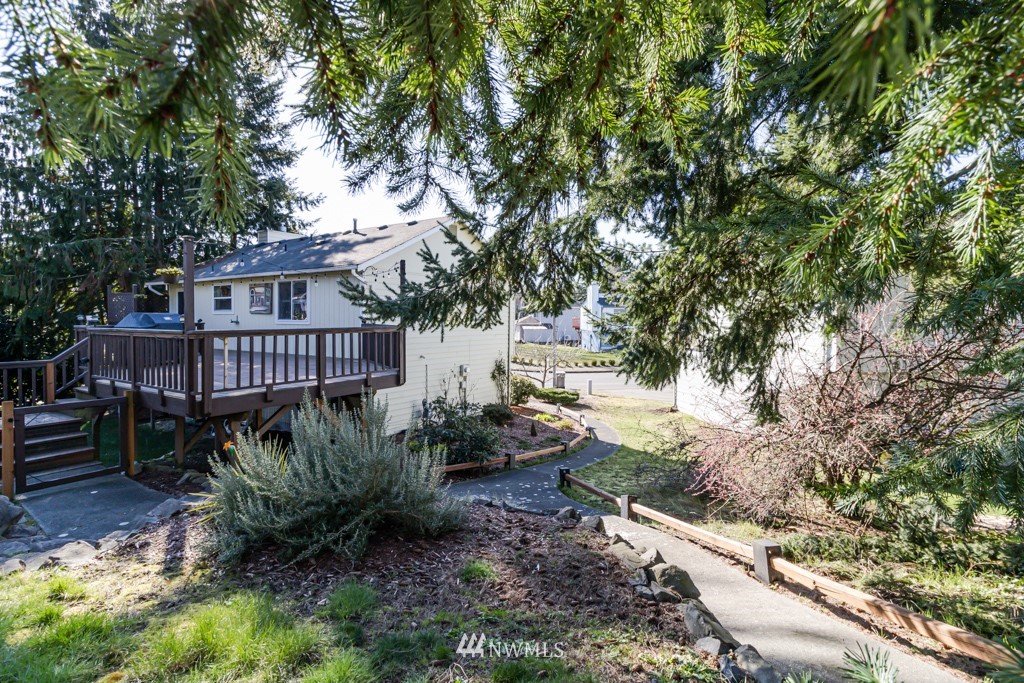 2829 Northeast 4th Court Renton, WA 98056 - Photo 26 of 26 a view of a house with a yard and sitting area