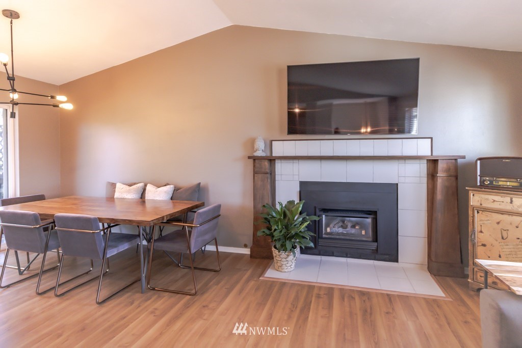 2829 Northeast 4th Court Renton, WA 98056 - Photo 6 of 26 a living room with furniture and a fireplace