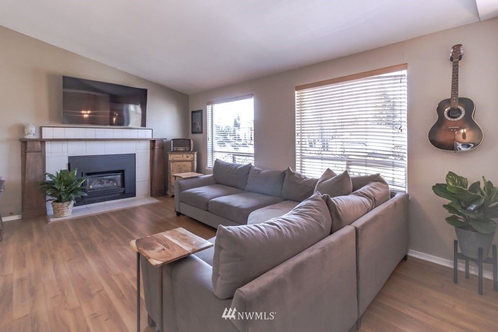 2829 Northeast 4th Court Renton, WA 98056 - Photo 9 of 26 a living room with furniture and a fireplace
