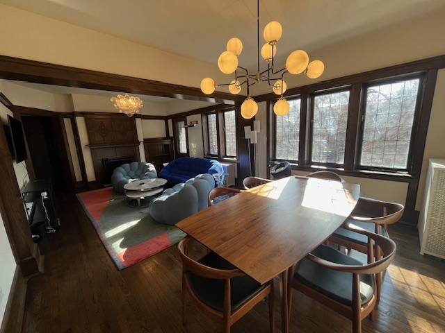 1372 East 57th Street, Unit 2 Chicago, IL 60637 - Photo 4 of 13 a view of a dining room with furniture and chandelier