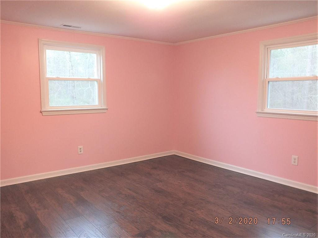 2035 Knight Road Lancaster, SC 29720 - Photo 18 of 26 an empty room with wooden floor and windows