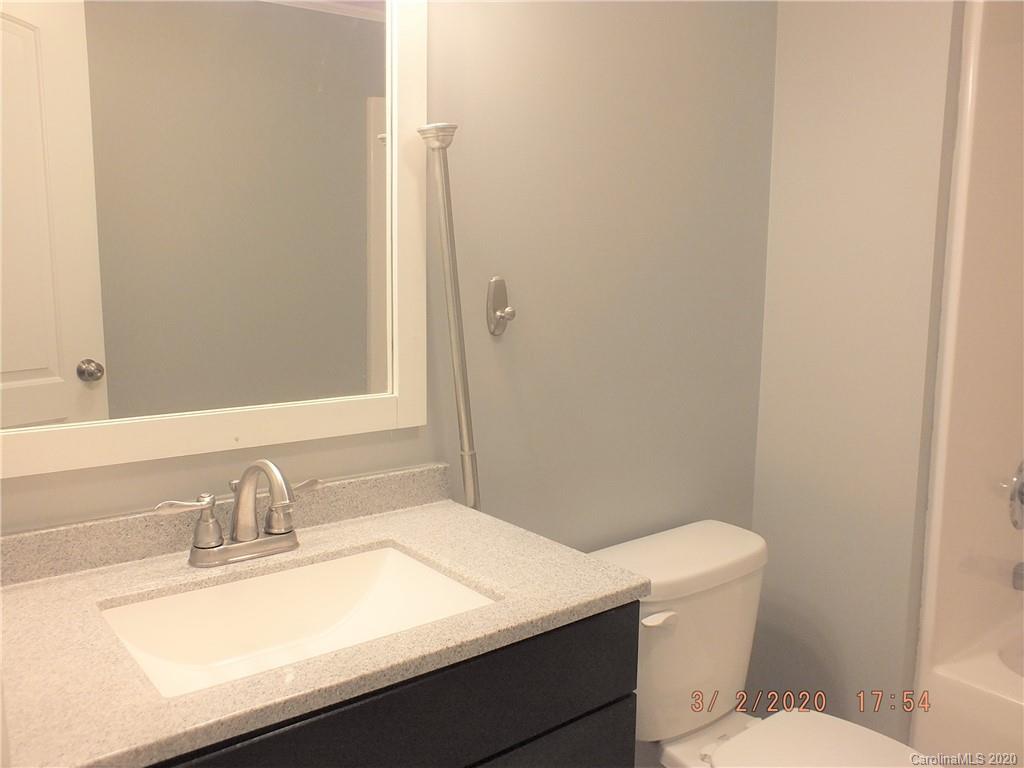 2035 Knight Road Lancaster, SC 29720 - Photo 20 of 26 a bathroom with a sink a toilet and mirror