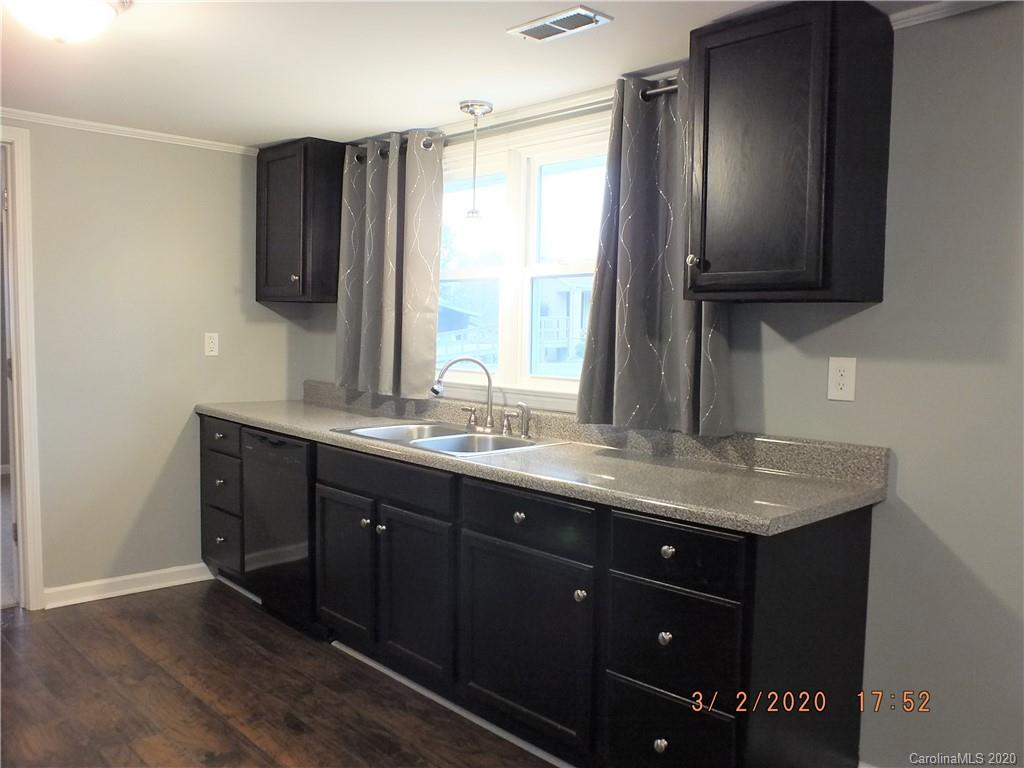 2035 Knight Road Lancaster, SC 29720 - Photo 5 of 26 a bathroom with a granite countertop sink and a mirror
