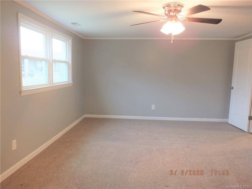 2035 Knight Road Lancaster, SC 29720 - Photo 10 of 26 an empty room with a window and a fan
