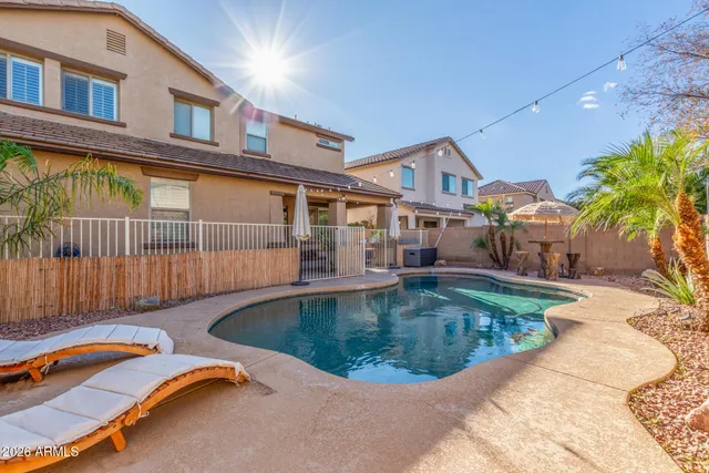 a view of a garden with a building in the background