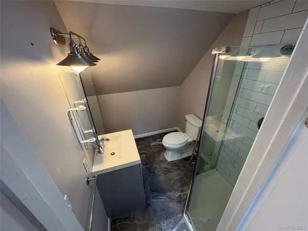 a bathroom with a toilet and a sink