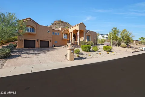 a view of a house with a sink and yard