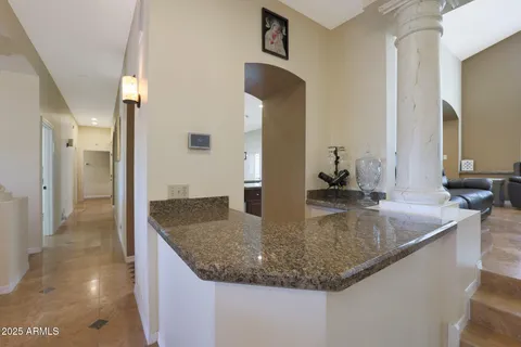 a view of a kitchen island a sink and dishwasher