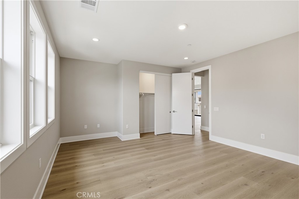 156 Apron Irvine, CA 92618 - Photo 33 of 40 a view of an empty room with wooden floor and a window