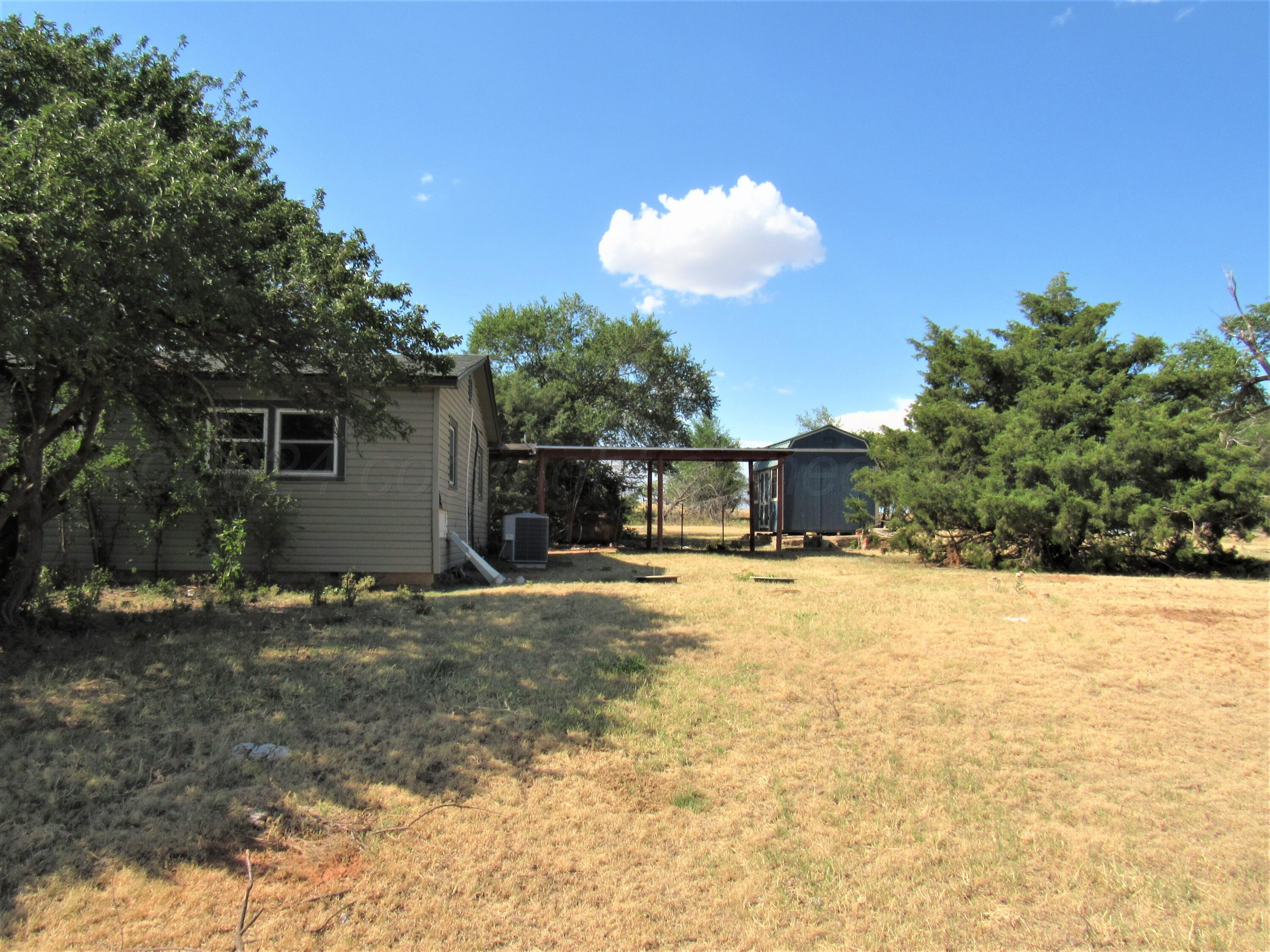 6761 County Road 11 Shamrock, TX 79079 - Photo 22 of 33 a view of a house with a yard and covered with snow