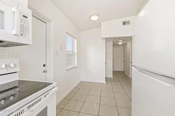 a view of a kitchen cabinets and a counter place