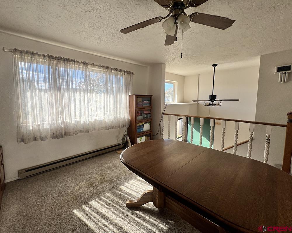 1328 Jackson Street Cortez, CO 81321 - Photo 16 of 37 a view of a room with furniture window and wooden floor