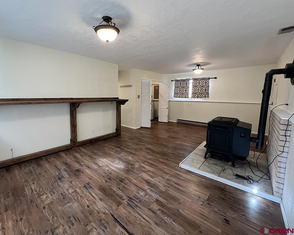 1328 Jackson Street Cortez, CO 81321 - Photo 3 of 45 a living room with hard wood floors and a wooden floors