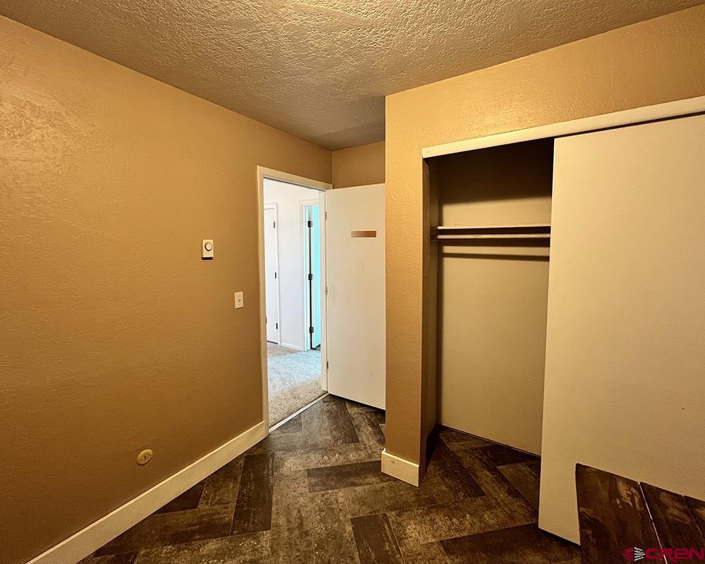 1328 Jackson Street Cortez, CO 81321 - Photo 32 of 45 a view of walk in closet with empty room