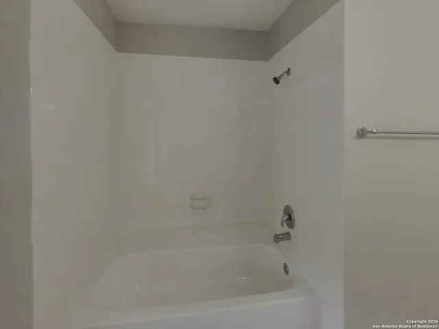 a close up of a bathtub curtain