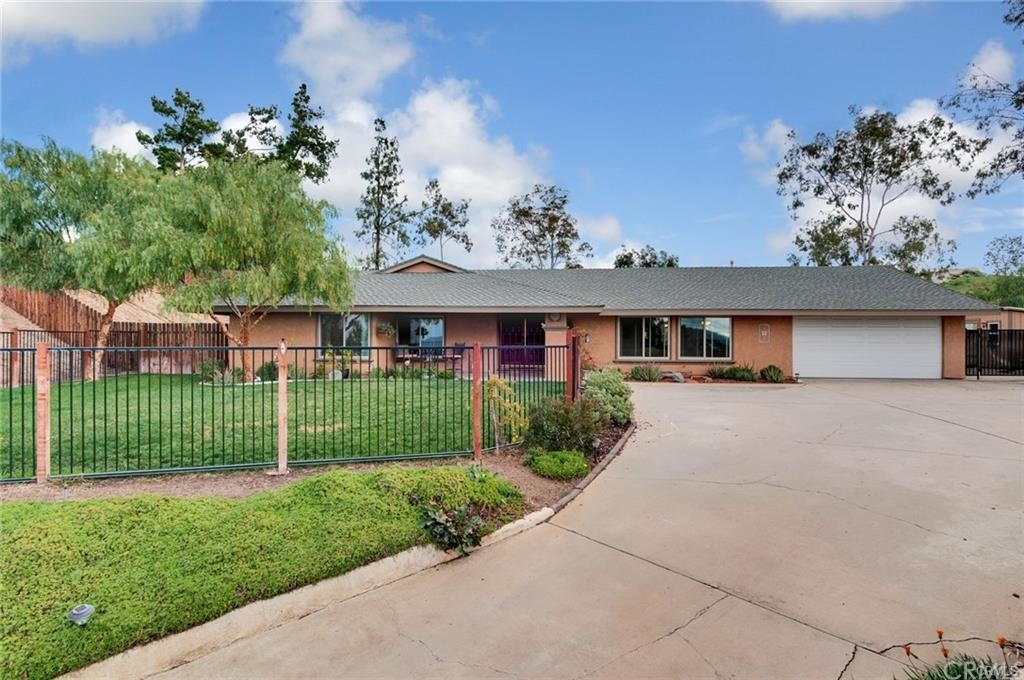 16300 Pick Place Riverside, CA 92504 - Photo 1 of 1 front view of a house with a garden