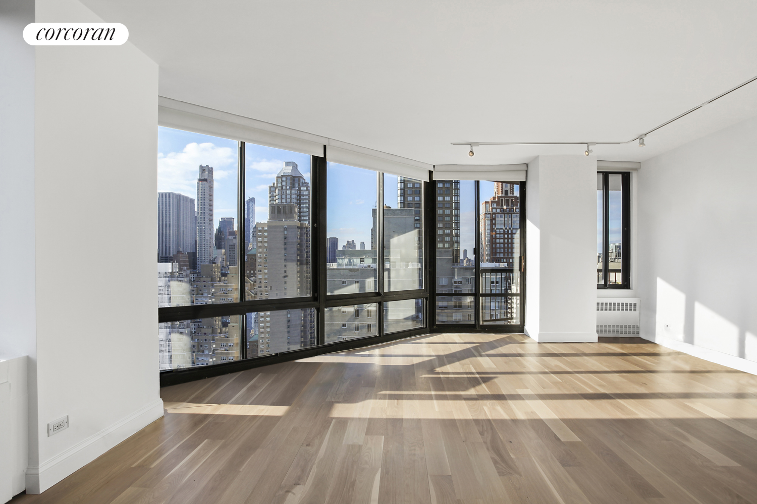 304 East 65th Street, Unit 26B Manhattan, NY 10065 - Photo 2 of 10 a view of a large window with wooden floor