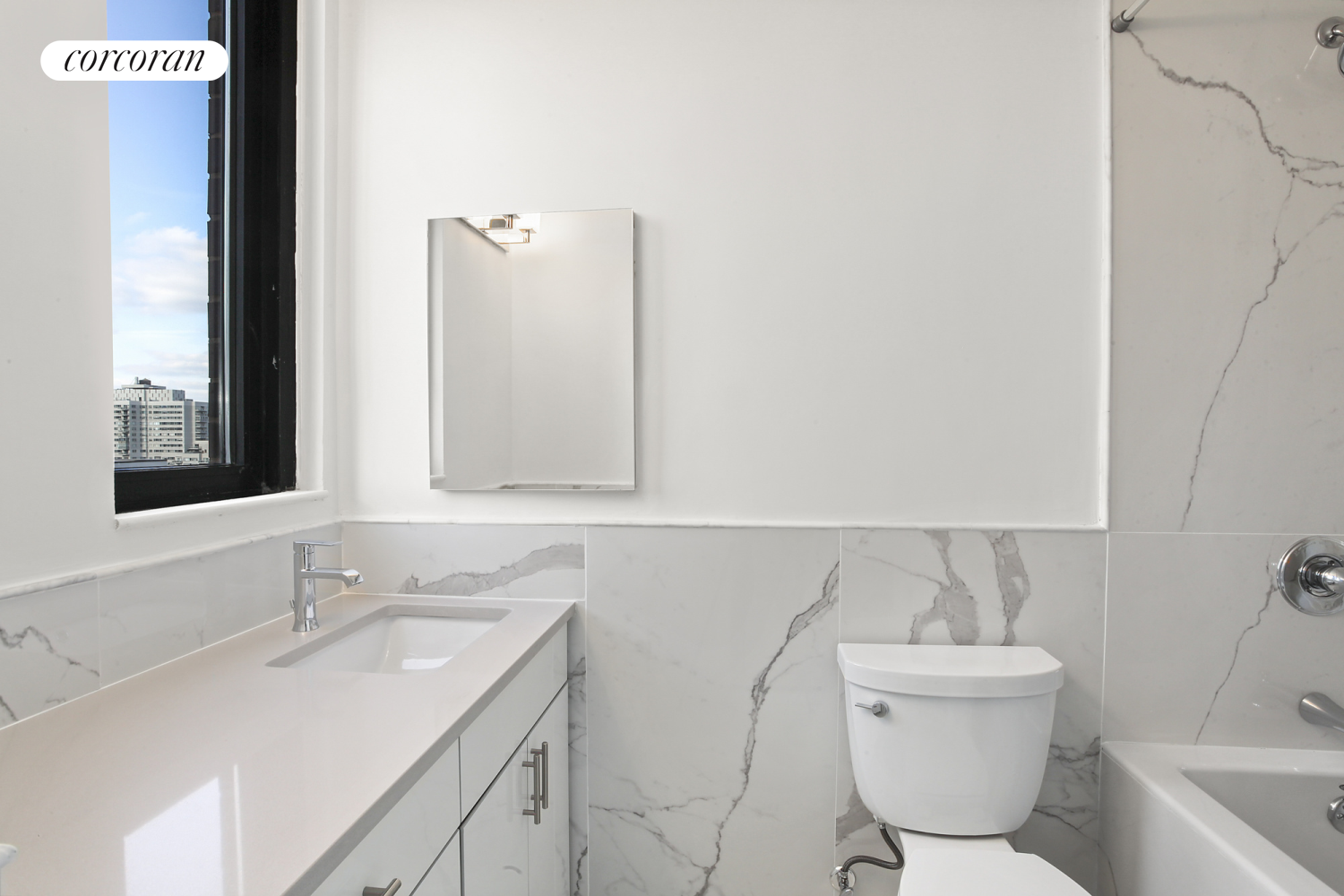 304 East 65th Street, Unit 26B Manhattan, NY 10065 - Photo 7 of 10 a bathroom with a toilet sink and mirror