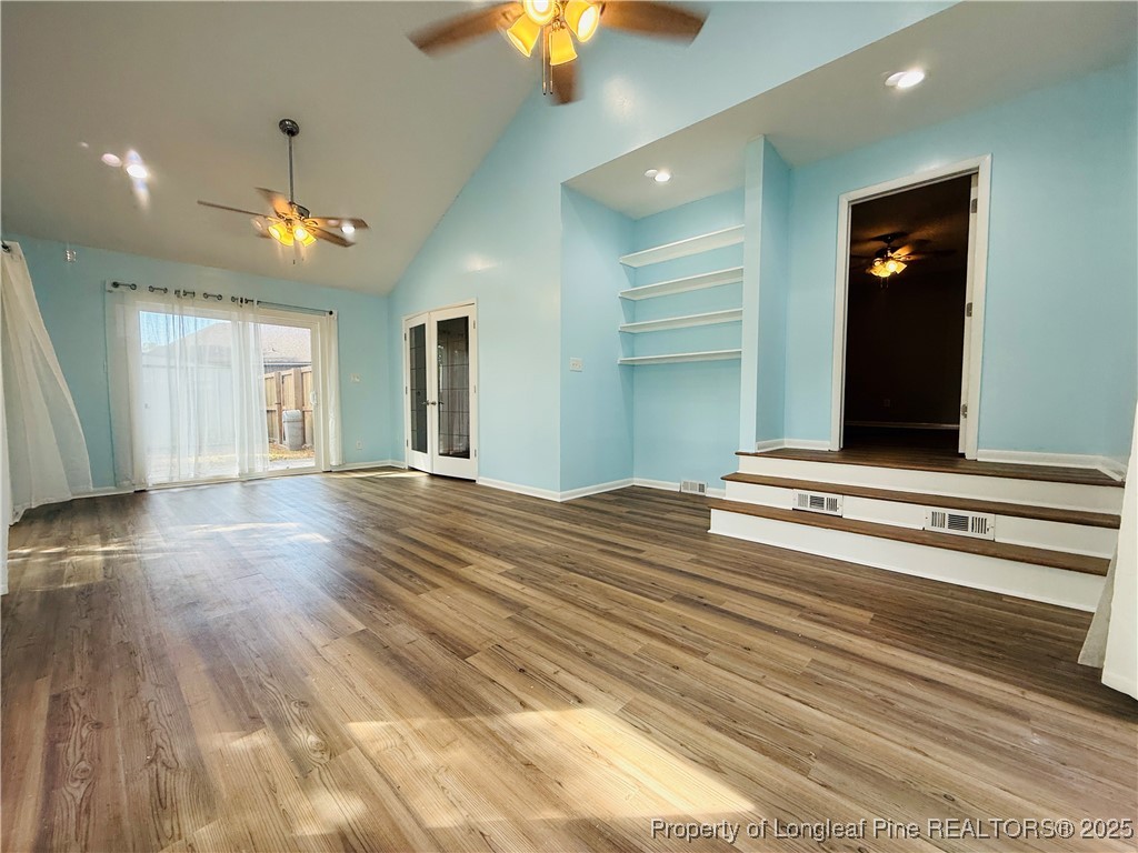 300 Wedge Court Hope Mills, NC 28348 - Photo 11 of 26 a view of a hallway with wooden floor and chandelier