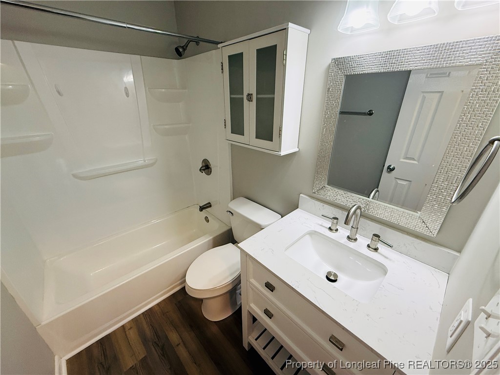 300 Wedge Court Hope Mills, NC 28348 - Photo 16 of 26 a bathroom with a sink a toilet and shower