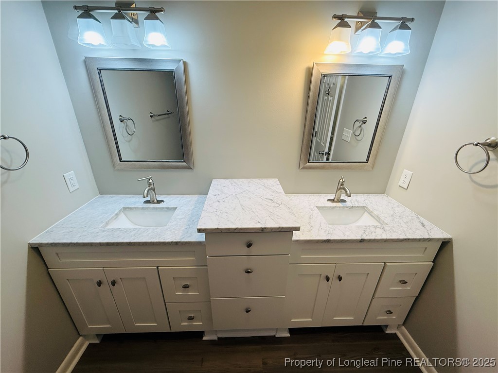 300 Wedge Court Hope Mills, NC 28348 - Photo 19 of 26 a bathroom with a sink vanity and mirror