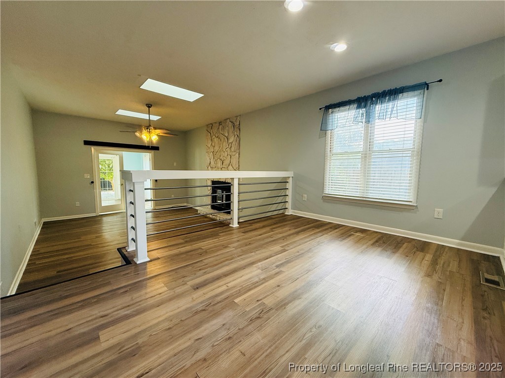 300 Wedge Court Hope Mills, NC 28348 - Photo 7 of 26 an empty room with wooden floor and window