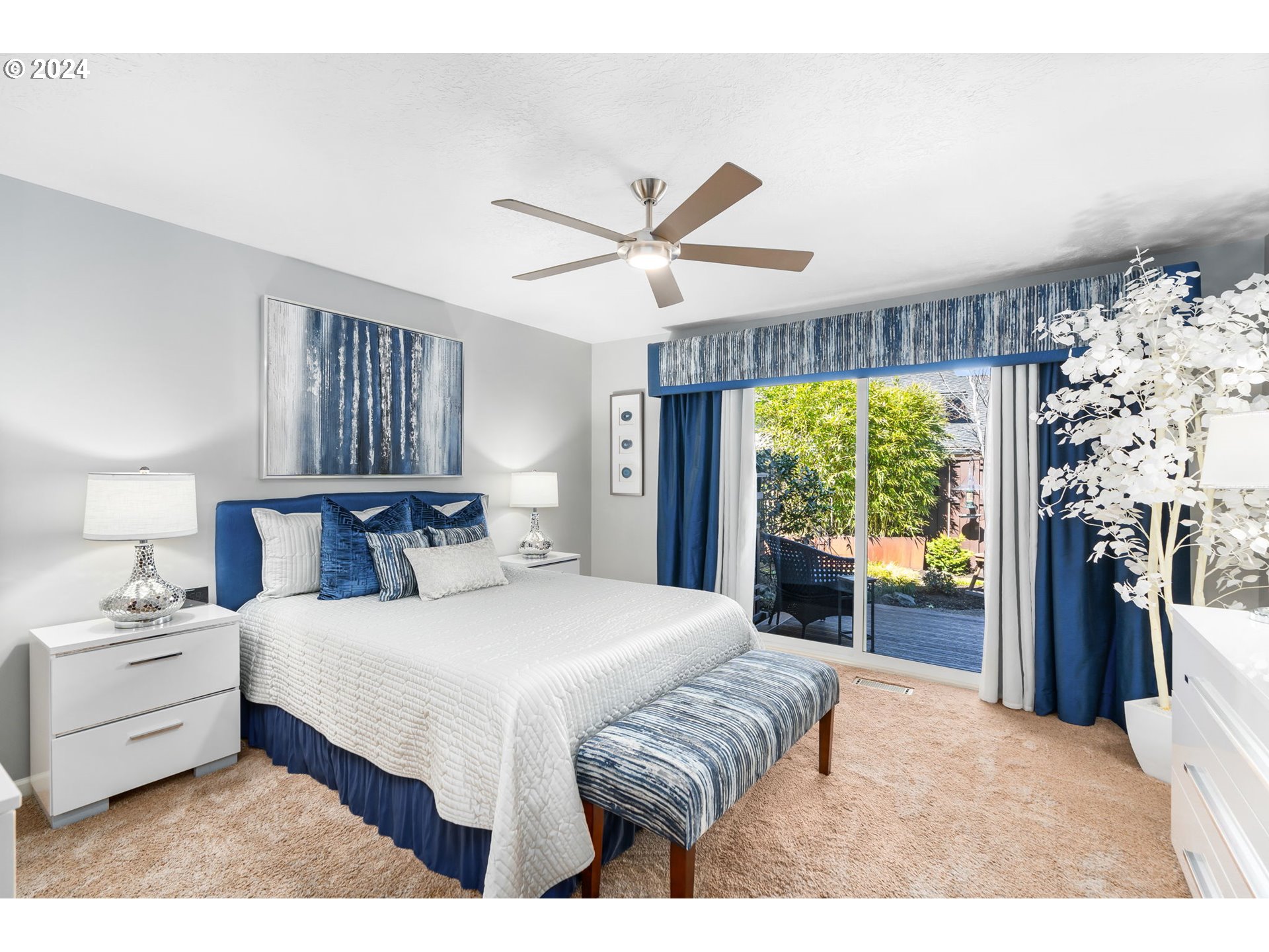 10 Condolea Drive Lake Oswego, OR 97035 - Photo 15 of 28 a bedroom with a large bed and a large window