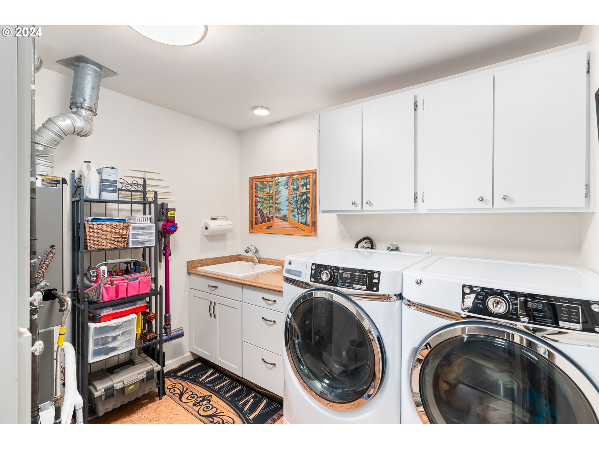 10 Condolea Drive Lake Oswego, OR 97035 - Photo 27 of 28 a utility room with sink dryer and washer