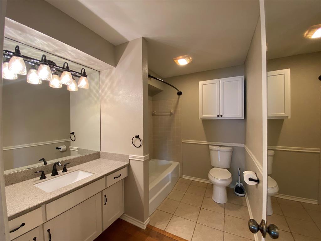 6 1 Main Place Benbrook, TX 76126 - Photo 13 of 28 a bathroom with a sink toilet and shower