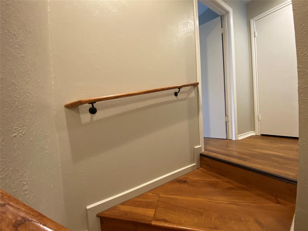 6 1 Main Place Benbrook, TX 76126 - Photo 15 of 28 a view of a room with wooden floor