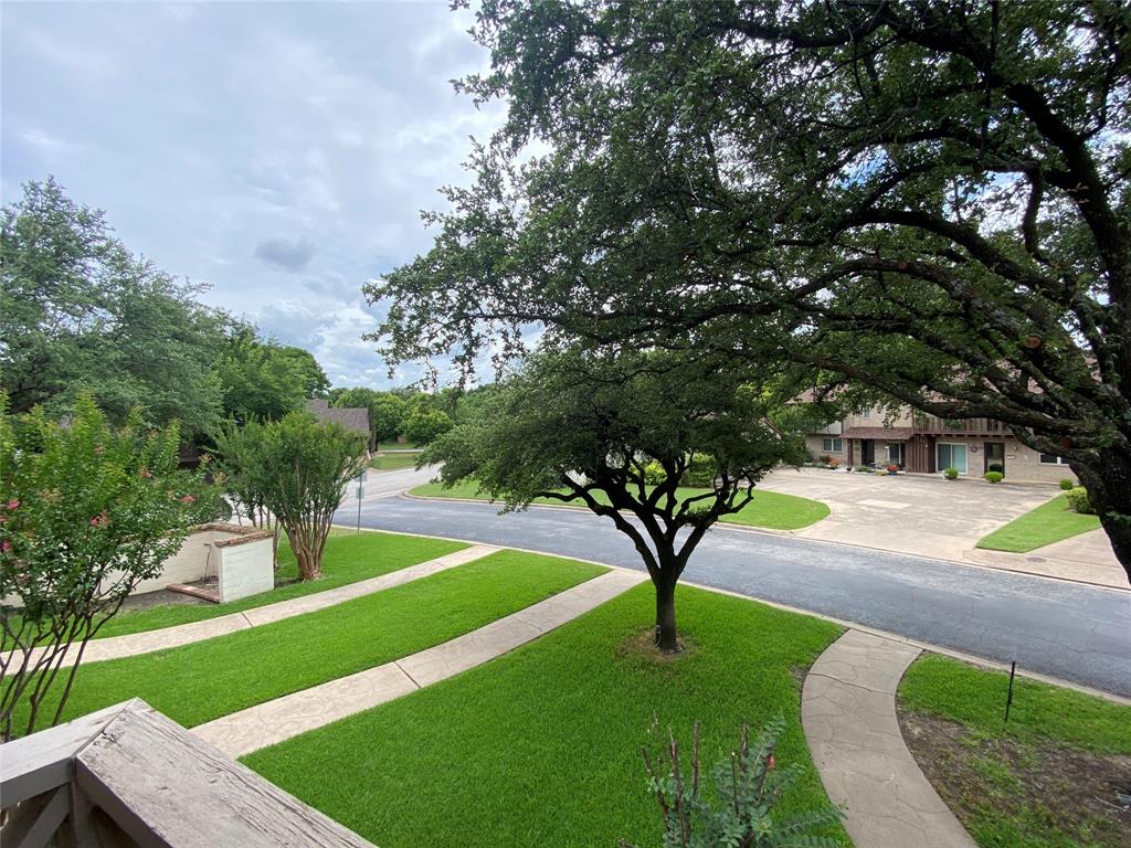 6 1 Main Place Benbrook, TX 76126 - Photo 20 of 28 a view of a garden with trees
