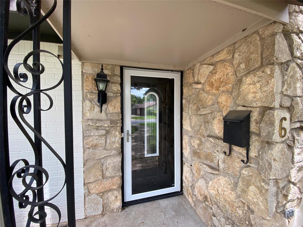 6 1 Main Place Benbrook, TX 76126 - Photo 2 of 28 a view of entryway with a front door and wooden floor