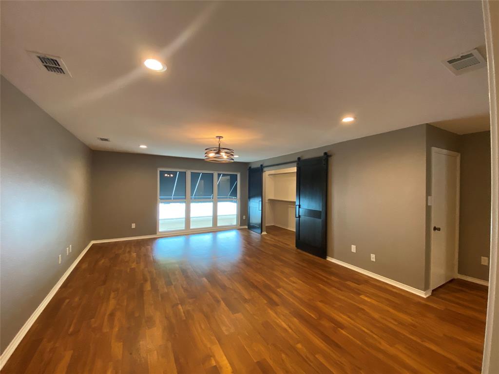 6 1 Main Place Benbrook, TX 76126 - Photo 21 of 28 a view of empty room with wooden floor