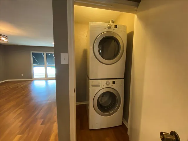 a view of a hallway with washer and dryer