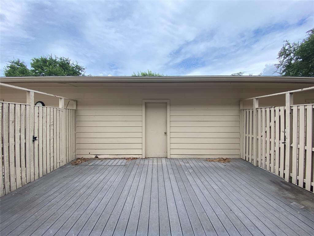 6 1 Main Place Benbrook, TX 76126 - Photo 26 of 28 an empty room with wooden floor and fence
