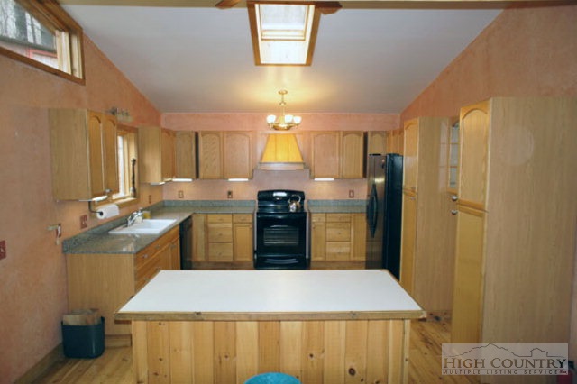 1994 Chestnut Grove Road Boone, NC 28607 - Photo 19 of 43 a kitchen with a sink appliances and cabinets