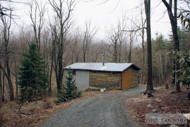 1994 Chestnut Grove Road Boone, NC 28607 - Photo 24 of 43 a brick house with a large tree