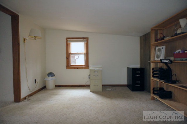 1994 Chestnut Grove Road Boone, NC 28607 - Photo 31 of 43 a view of an empty room with closet and a window