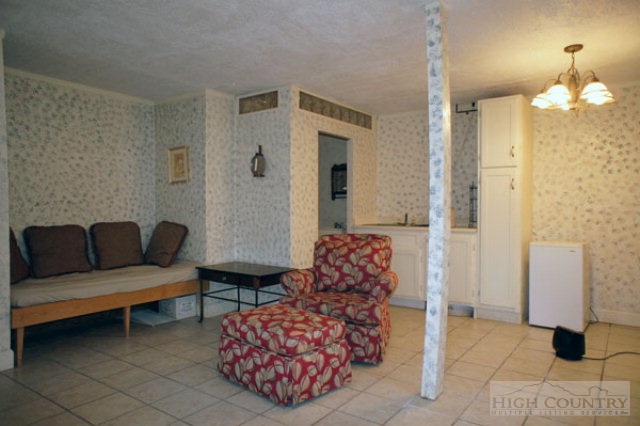 1994 Chestnut Grove Road Boone, NC 28607 - Photo 4 of 43 a living room with furniture and a chandelier