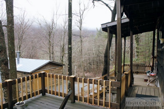 1994 Chestnut Grove Road Boone, NC 28607 - Photo 10 of 43 a view of a wooden deck and a yard