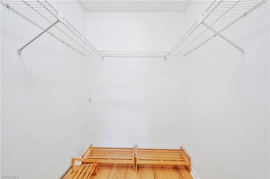 4357 27th Court Southwest, Unit 101 Naples, FL 34116 - Photo 14 of 25 a view of a room with racks on the wall