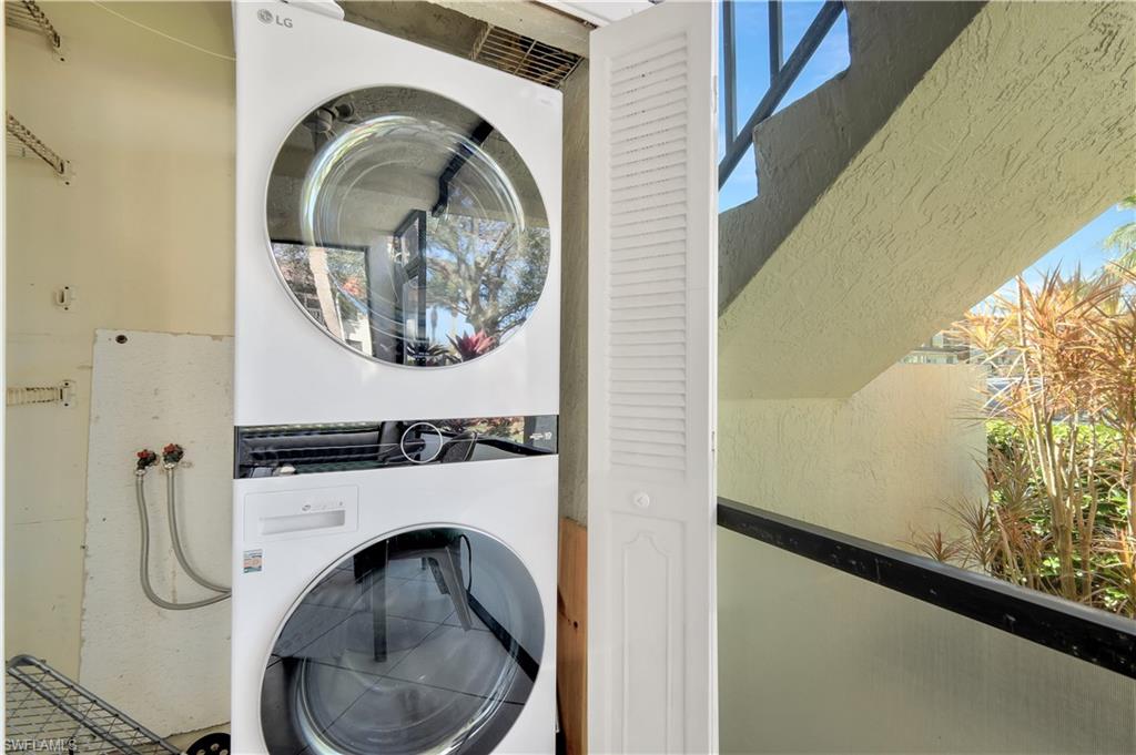 4357 27th Court Southwest, Unit 101 Naples, FL 34116 - Photo 18 of 25 a close view of a utility room with dryer and washer