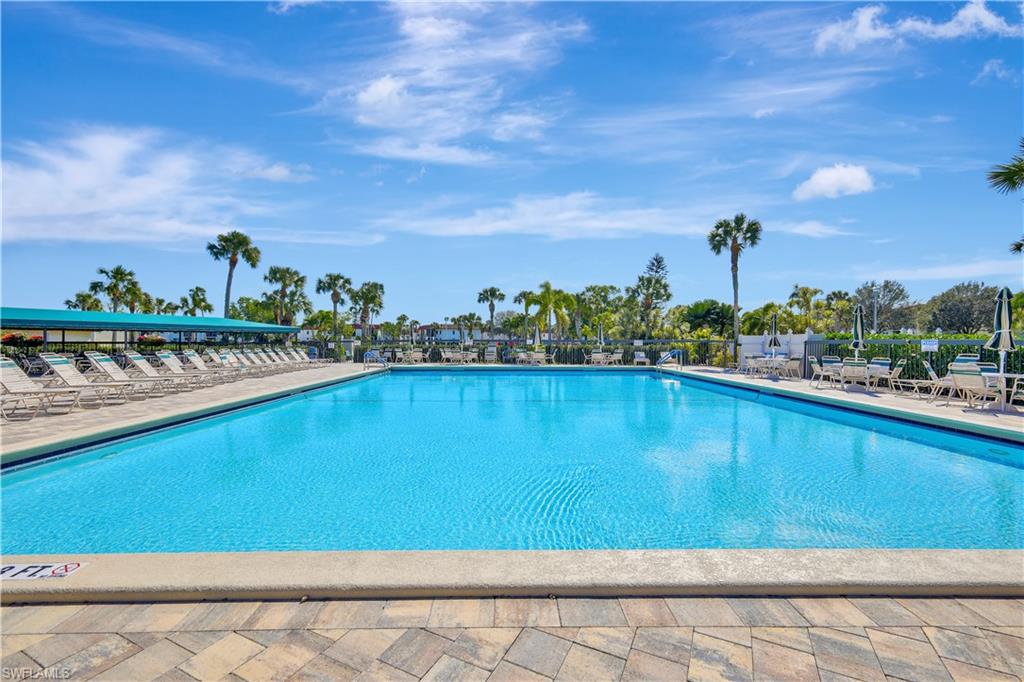 4357 27th Court Southwest, Unit 101 Naples, FL 34116 - Photo 21 of 25 a view of swimming pool with outdoor space and seating area
