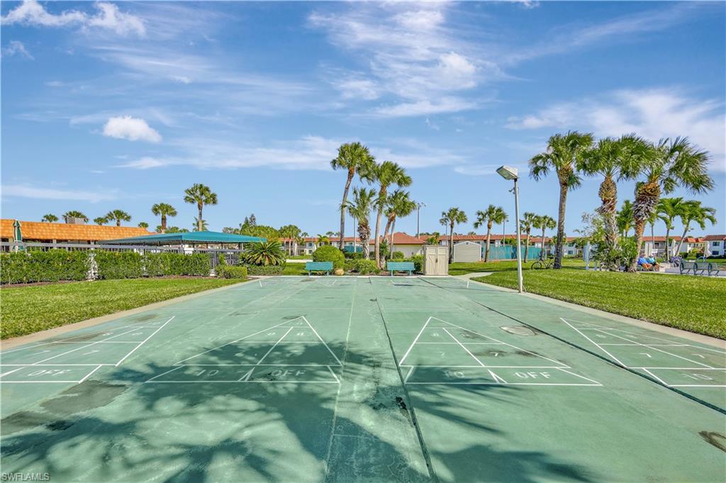 4357 27th Court Southwest, Unit 101 Naples, FL 34116 - Photo 24 of 25 a view of a playground with basketball court