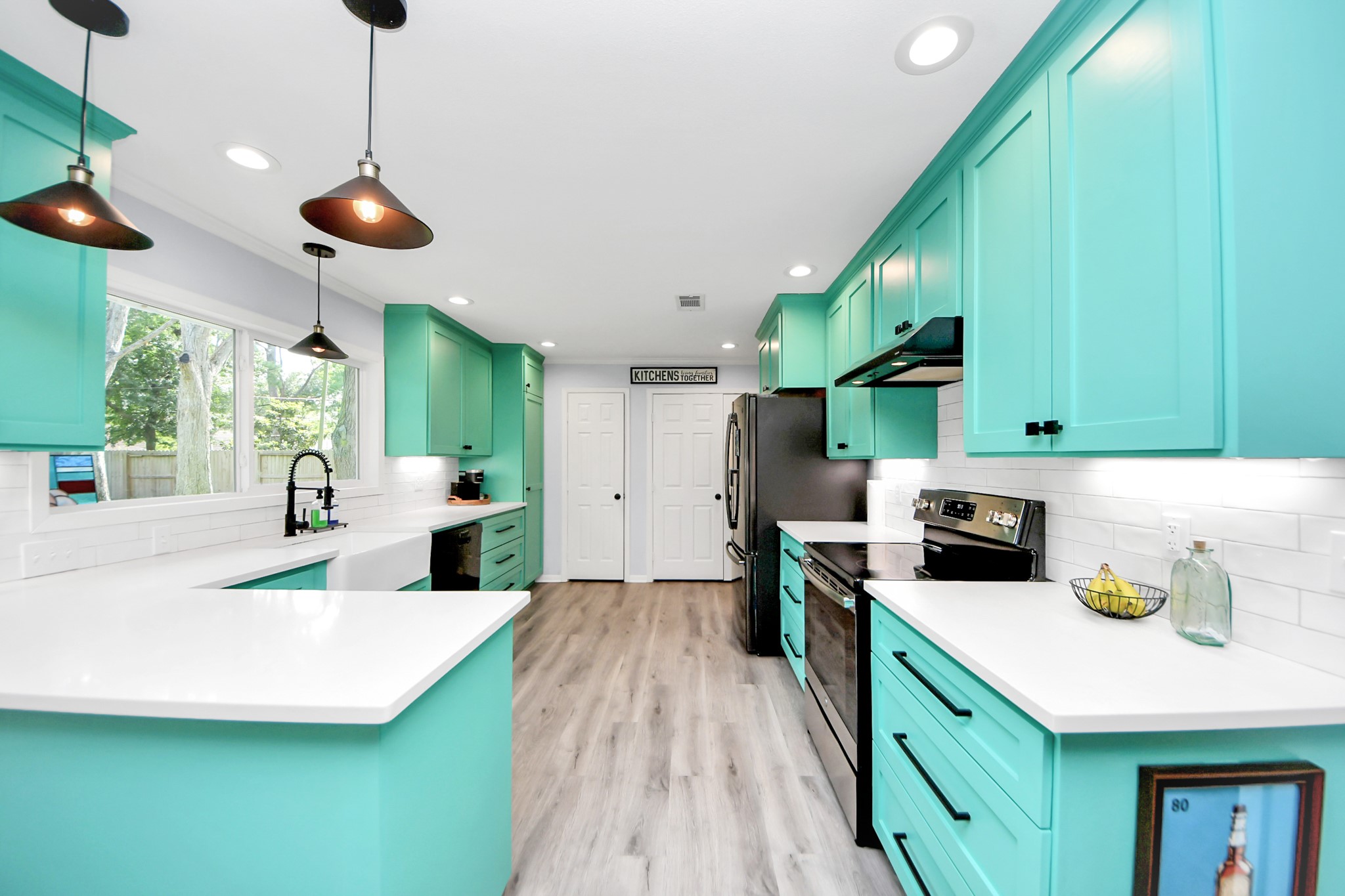 205 Cedar Lane El Lago, TX 77586 - Photo 10 of 44 a kitchen with stainless steel appliances a stove a sink a refrigerator and cabinets