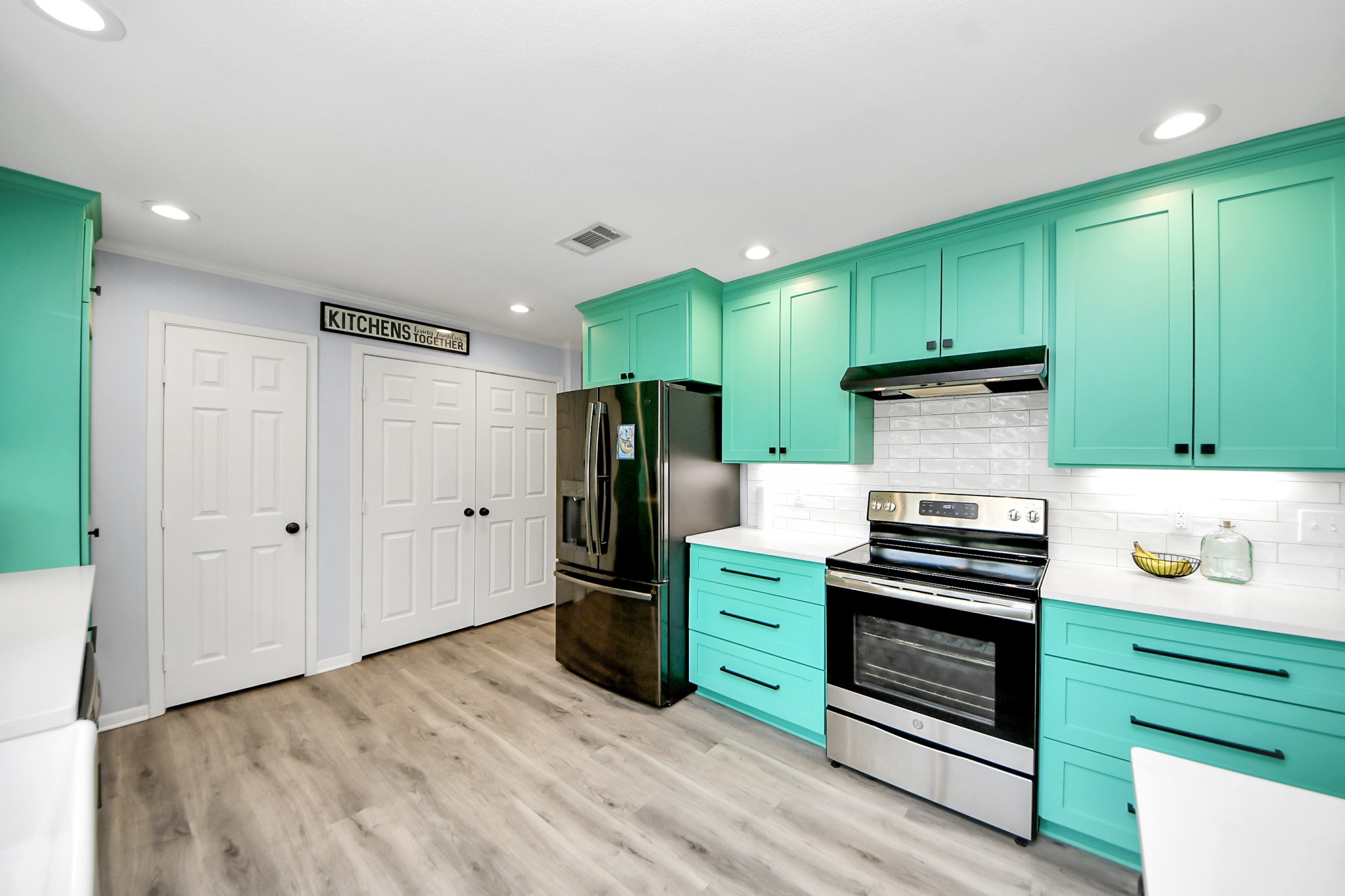 205 Cedar Lane El Lago, TX 77586 - Photo 16 of 44 a kitchen with stainless steel appliances a refrigerator and a stove top oven