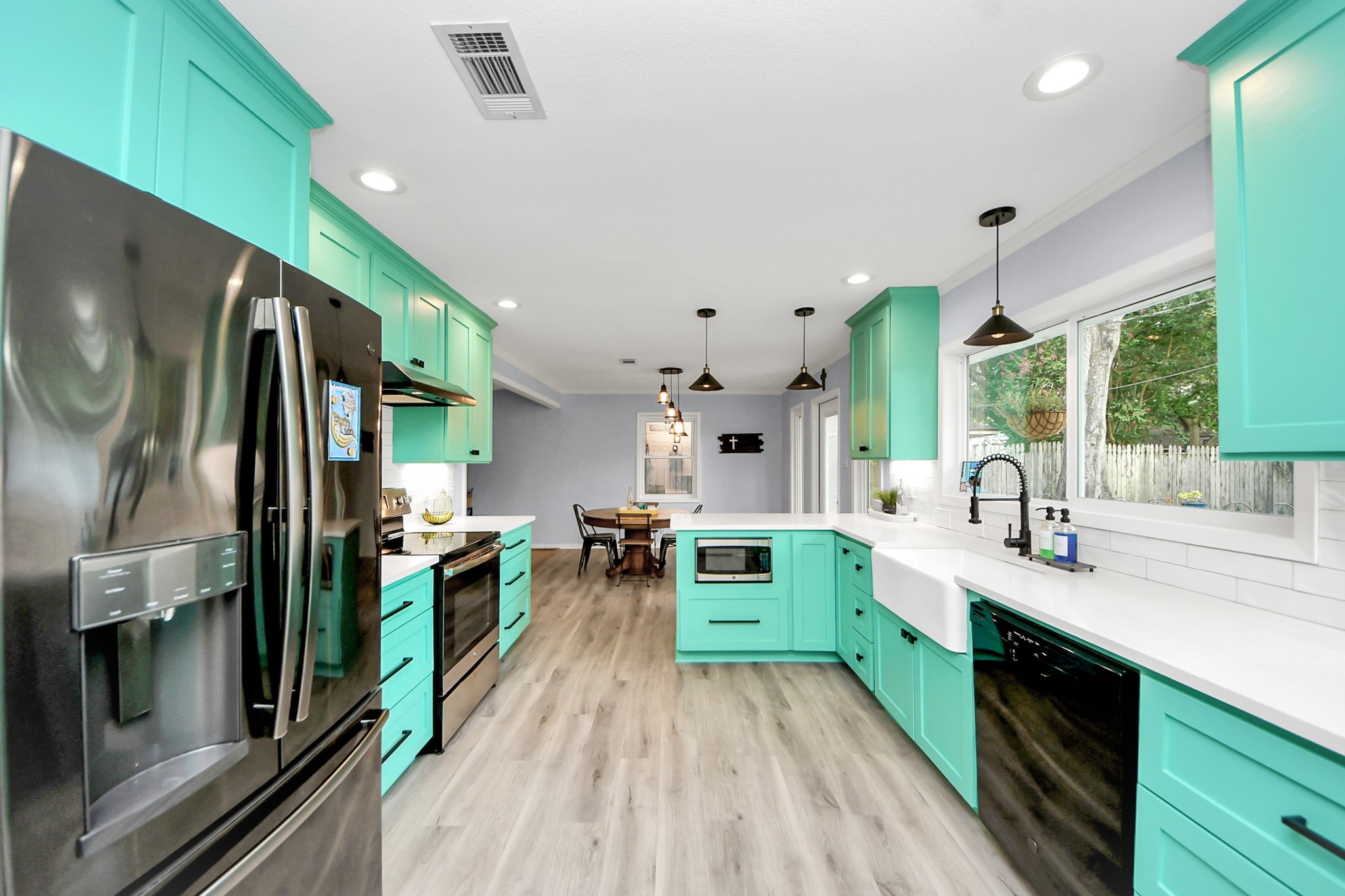 205 Cedar Lane El Lago, TX 77586 - Photo 20 of 44 a kitchen with lots of counter top space and wooden floor